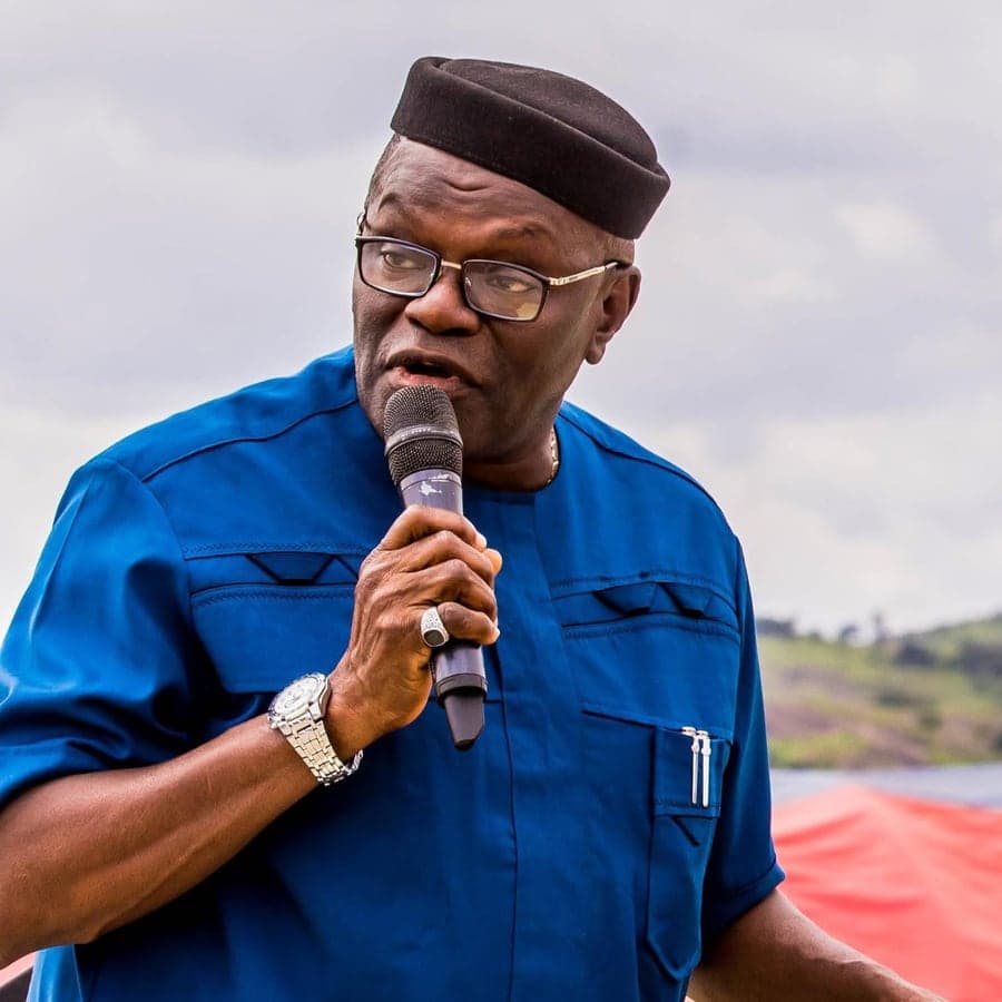 Mr Yanju Adegbite, Grand Patron of Love & Light Foundation, speaking with a microphone at an outdoor gathering